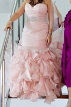 Load image into Gallery viewer, Pink ruffled gown with a silver belt worn by a person on a staircase.