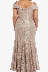 Woman wearing a beige off-shoulder lace dress on a white background