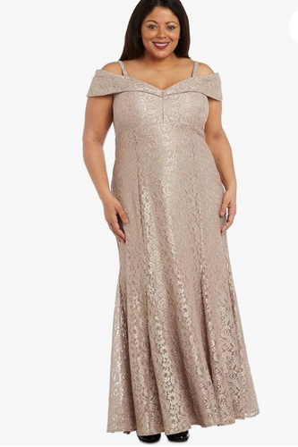 Woman wearing a beige off-shoulder lace dress on a white background