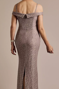 Woman wearing a patterned off-shoulder gown on a beige background