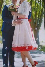 Load image into Gallery viewer, Two people in formal attire standing outdoors with trees in the background