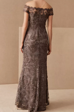 画像をギャラリービューアに読み込む, Woman wearing a long, off-shoulder lace dress against a beige background