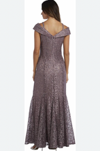 Load image into Gallery viewer, Woman wearing a long, patterned dress on a white background