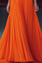 Load image into Gallery viewer, Orange pleated dress on a blurred background