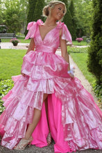 Cargar imagen en el visor de la galería, Woman in a pink gown standing outdoors with greenery in the background