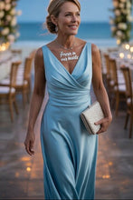 Carica l&#39;immagine nel visualizzatore di Gallery, Woman in a light blue dress with &#39;Forever in our hearts&#39; necklace at an outdoor event.